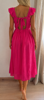 Robe Judith brodée rose fuchsia – vue de dos, coupe longue fluide | Coka Collection