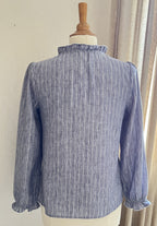 Vue arrière blouse Adèle In April 1986 rayures bleu argenté