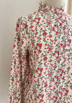 Détail finitions blouse Mila rouge vert In April 1986